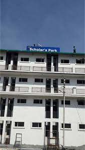 Exterior view of the Scholar's Park building near UPES